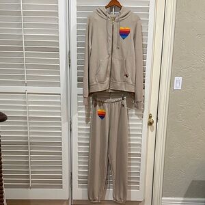 Aviator Nation Beige sweatsuit with colorful heart appliqué. Size Medium